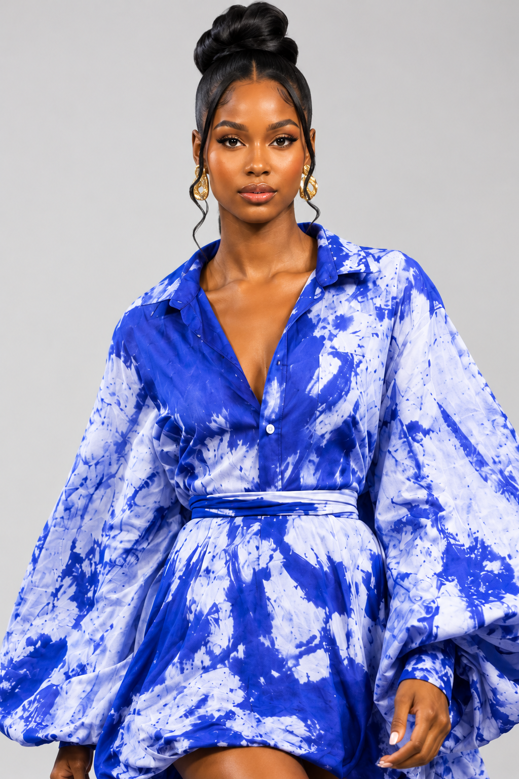 Fashion creator in a cobalt blue patterned dress
